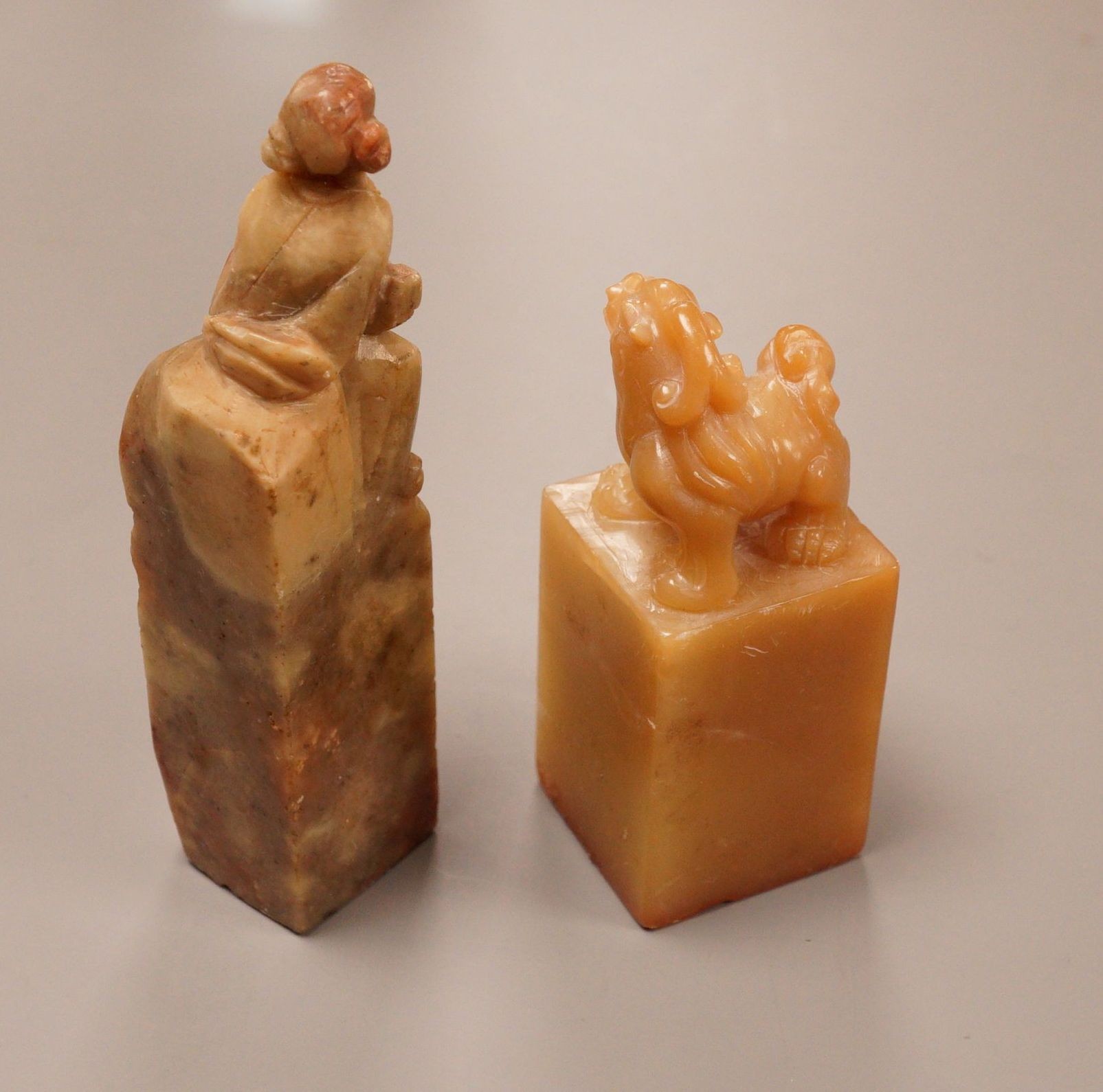 Two Chinese soapstone seals, tallest 10cm